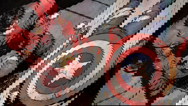 Homem de Ferro junto ao corpo de Capitão América